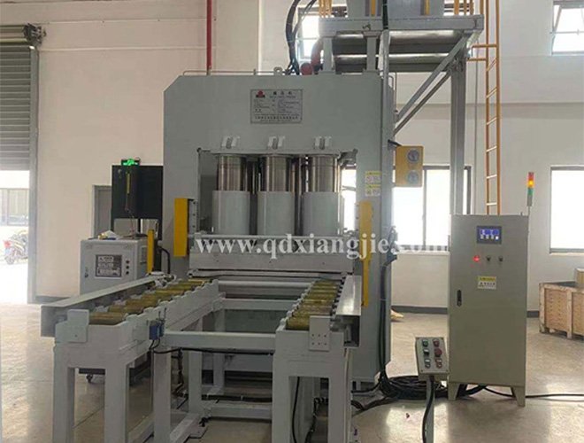 Downward pressure rubber vulcanizer