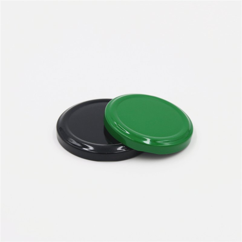 Metal twist off cap for jars black and green color