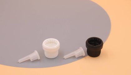 What is the material of the plastic bottle cap?