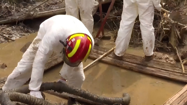 Construction workers are working in protective coveralls